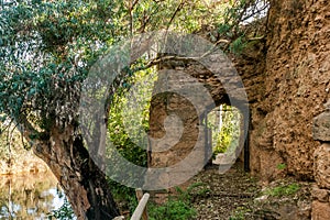 Door inside the rampart of medieval stone that surrounds village of Niebla, Huelva, Spain photo